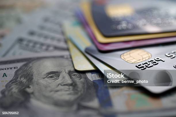 Credit Cards On Dollars Stock Photo - Download Image Now - Credit Card, Coin, Customer