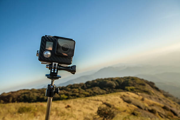 istock Action camera with selfie pole on the peak of mountain 504705774