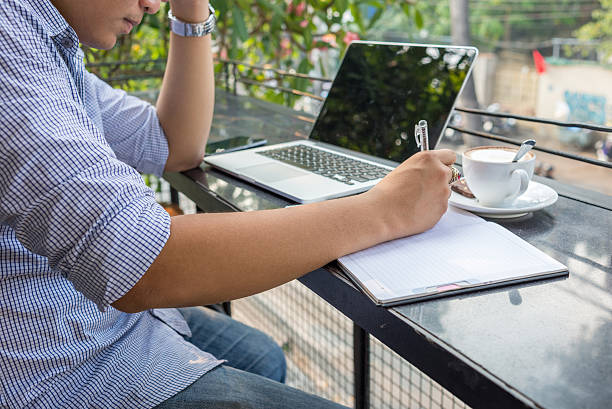 istock Trying to think out every single word when writing letter 504705926