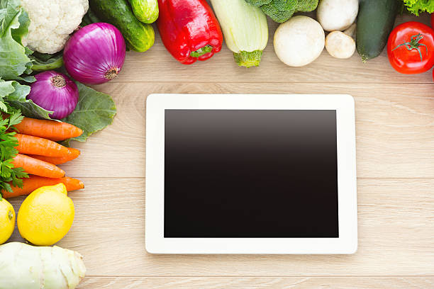 istock Digital cookbook and various fresh vegetables 504706163