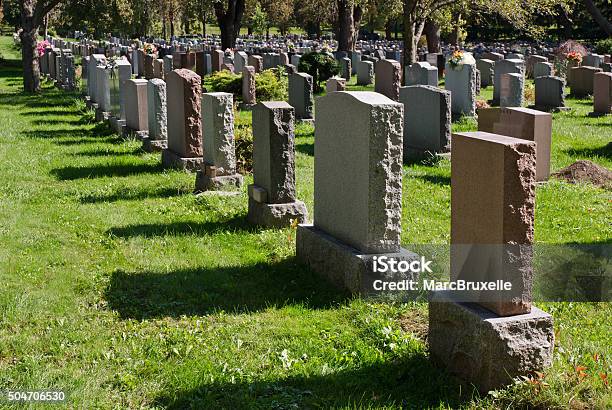 Gravestones In An American Cemetery Stock Photo - Download Image Now - Cemetery, Tombstone, Grave