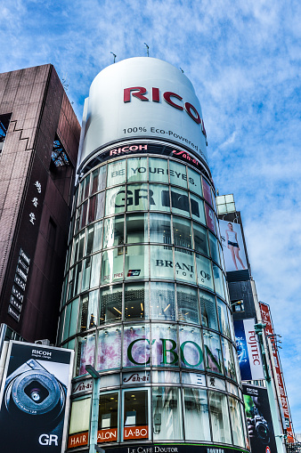 Tokyo, Japan - November 21, 2015: Ginza district in Tokyo. The Ginza is Tokyo's most famous upmarket shopping, dining and entertainment district, featuring numerous department stores, boutiques, art galleries, restaurants, night clubs and cafes. One square meter of land in the district's center is worth over ten million yen, making it one of the most expensive real estate in Japan. It is where you can find the infamous $10 cups of coffee and where virtually every leading brand name in fashion and cosmetics has a presence.