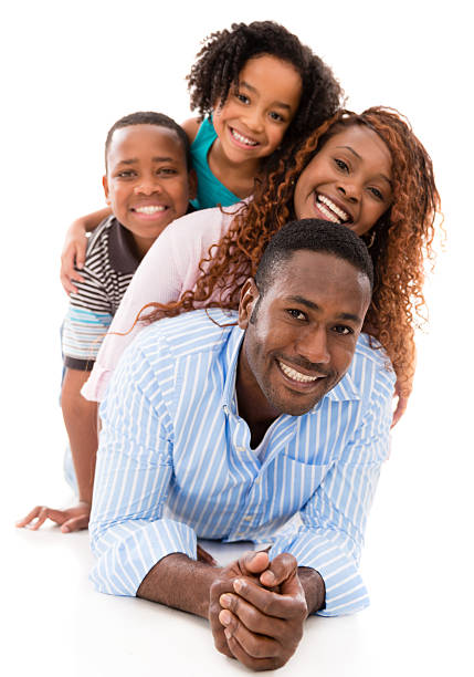 Family having fun Happy family having fun and smiling - isolated over white woman lying on the floor isolated stock pictures, royalty-free photos & images