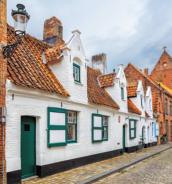 istock Bruges historical pitched roofs and spiers 504707318