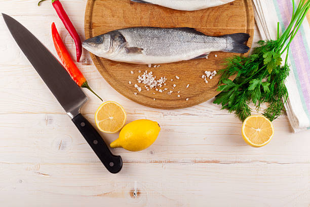 istock Two fresh sea bass on a white background. Top view. 504707482