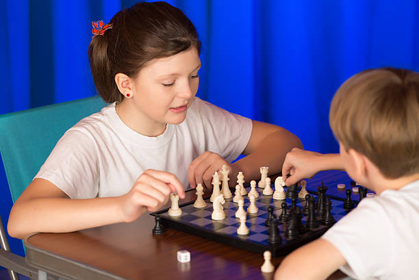 istock Children play a board game called chess. 504707692