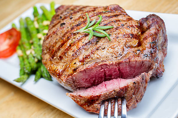 istock Big Rib Eye Beef Steak With Bite Cut Out 504707945