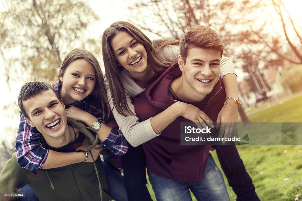 Group of happy teenage friends having fun Two happy teenage couples are having fun  Teenager Stock Photo