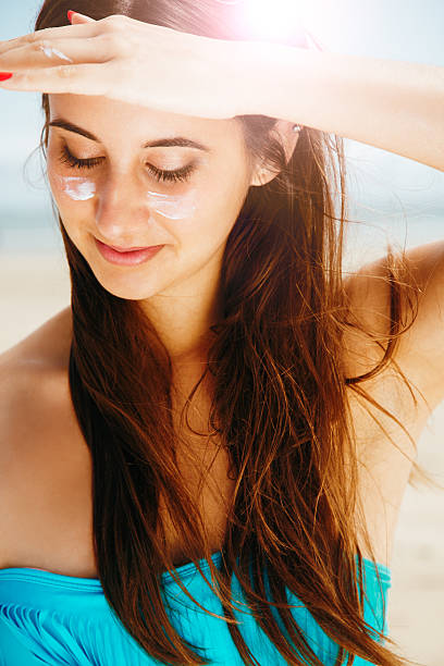 istock Woman protecting her face from sun 504708228