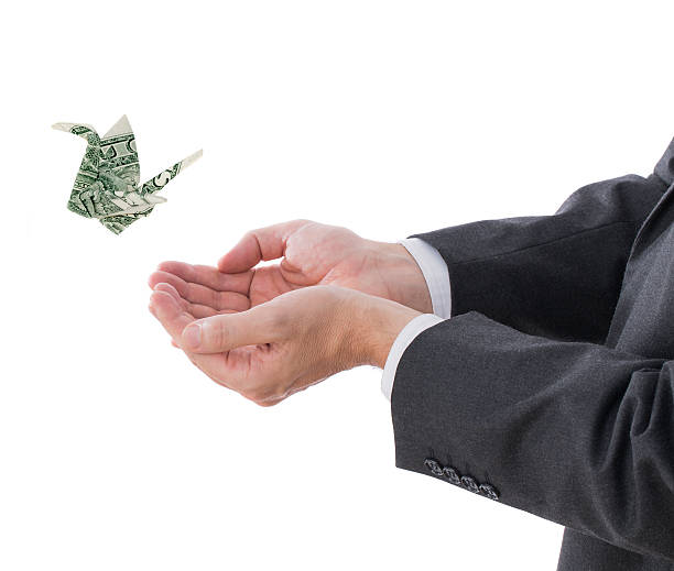 istock Money flying away 504708510