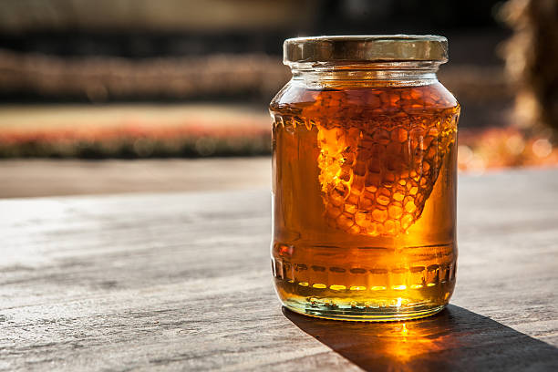 Honeycomb in honey Jar on the table