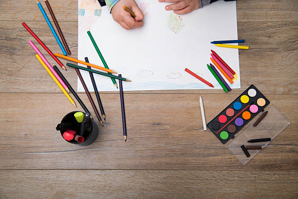 istock Child drawing on a white paper 504708796