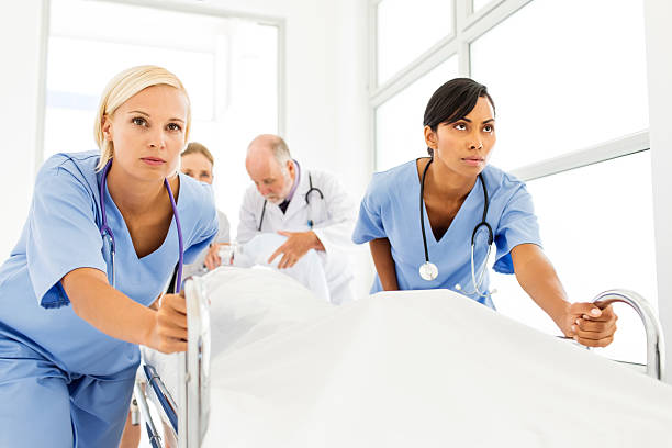 istock Determined Nurses Pushing Patient On Hospital Gurney 504709997