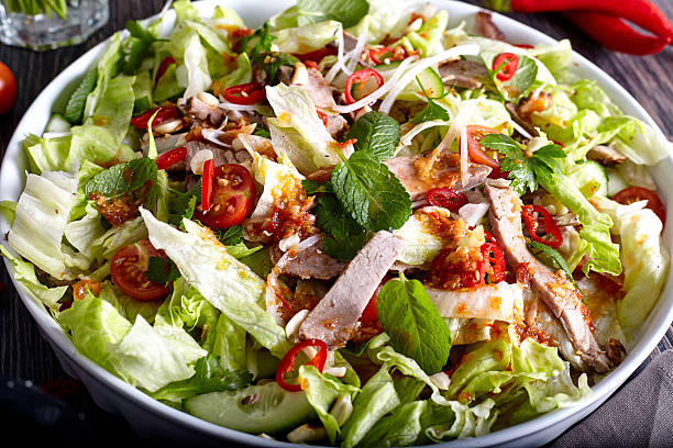 istock Spicy thai salad with beef and green herbs 504710054