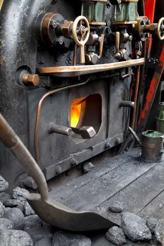 The firebox in the cab of a working railway steam engine