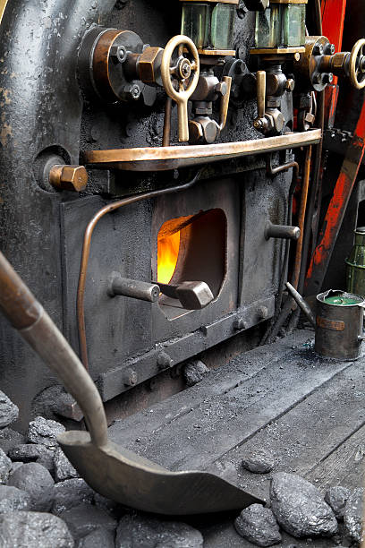 Firebox on a steam engine The firebox in the cab of a working railway steam engine firebox steam engine part stock pictures, royalty-free photos & images