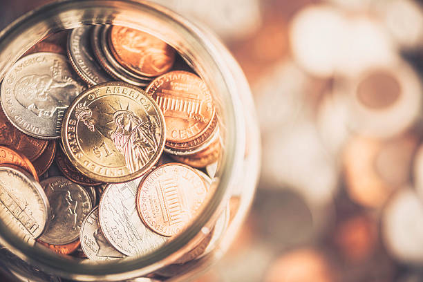 istock Cash Jar Filled with Cash Donations 504710983