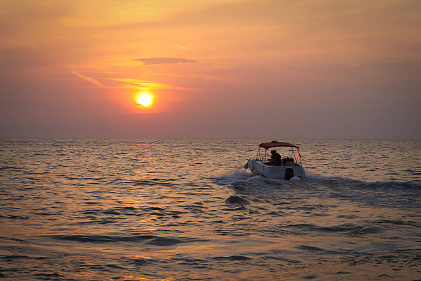 istock Silhouette Boat in the sea 504711373