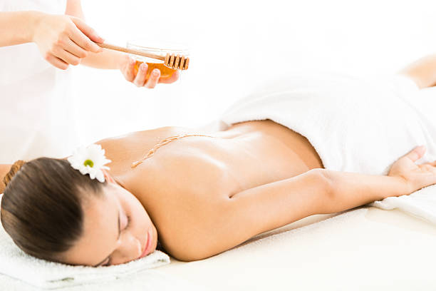 istock Woman having massage with honey 504712267