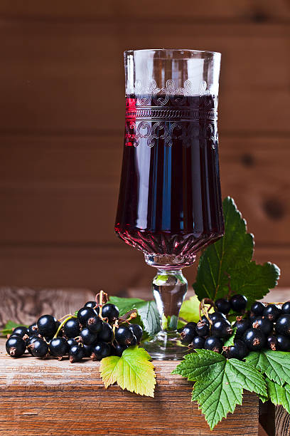 istock black currant liquor and ripe berries 504712299