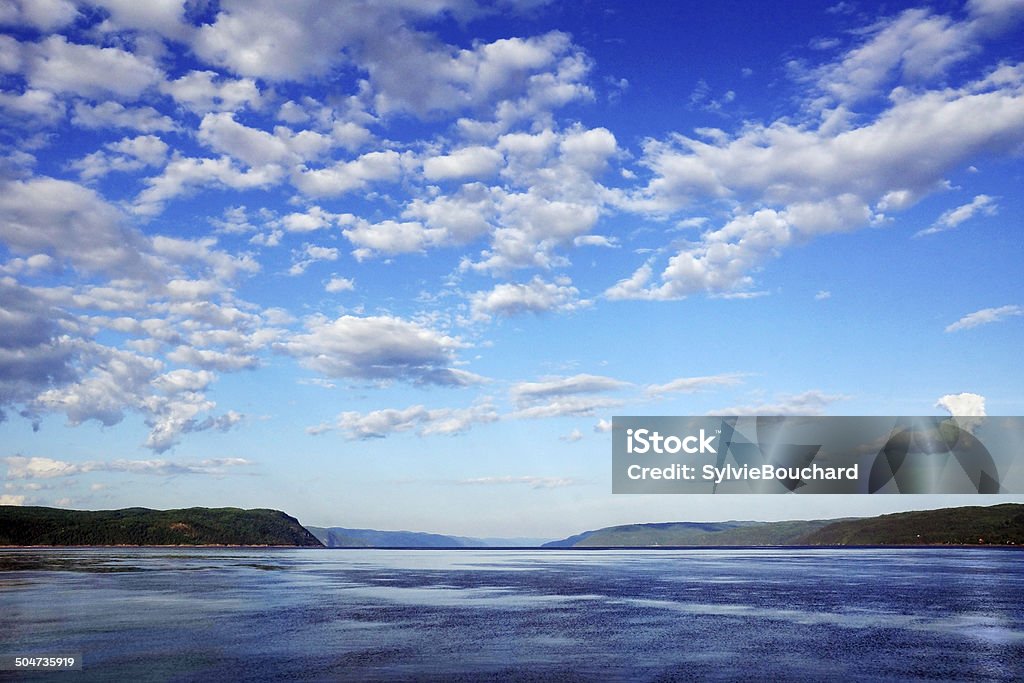 Bay with cloudy sky Beautiful fjord's bay landscape with blue sky Saguenay Stock Photo