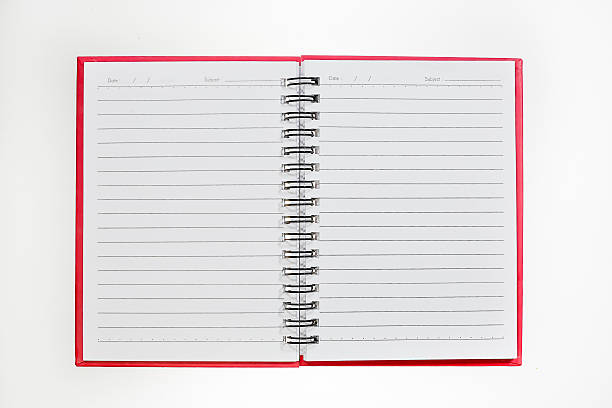 istock blank background. paper spiral notebook isolated on white 504736525