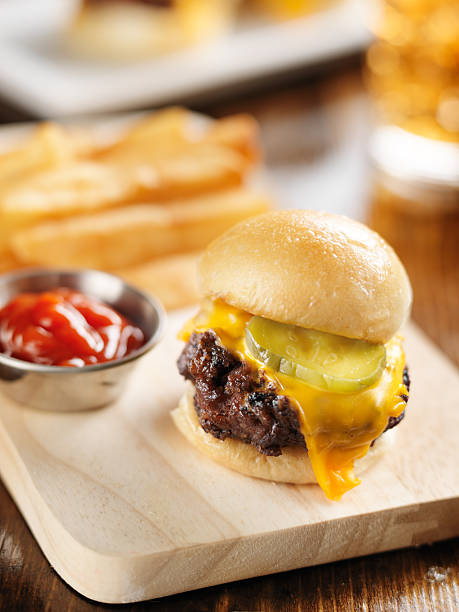 istock burger slider close up on wood cutting board 504741197