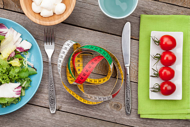 istock Fresh healthy salad, tomatoes, mozzarella and measuring tape. He 504741477