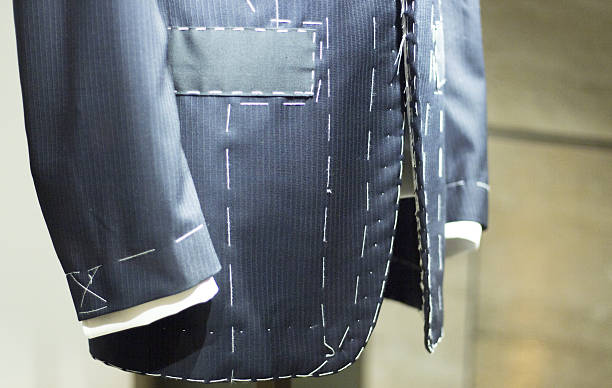 istock Store clothes dummy in suit shop 504741584