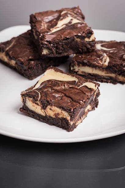 istock Chocolate Cheesecake Swirl Brownies on a Plate 504742072