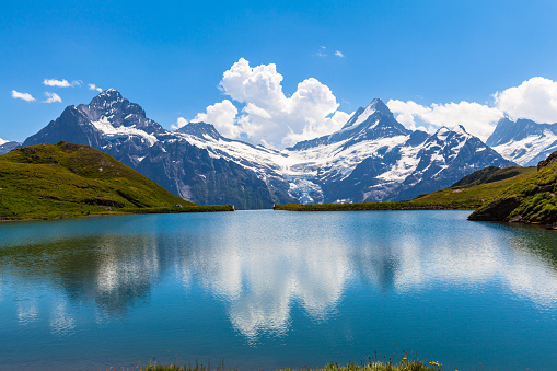 Panorama view of Bachalpsee and the snow coverd peaks including Schreckhorn, Wetterhorn with glacier of swiss alps, on Bernese Oberland, Switzerland.