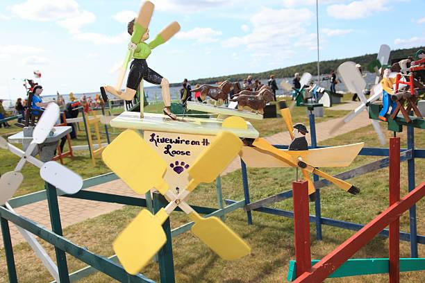 Shelburne, Canada - September 20, 2014: Whirligigs at Shelburne, Nova Scotia, Canada, whirligig festival, This festival is on annually some are for sale there. Shallow focus and motion blur due to the fact it is windy usually makes the actions of these whirligig work. Folk art