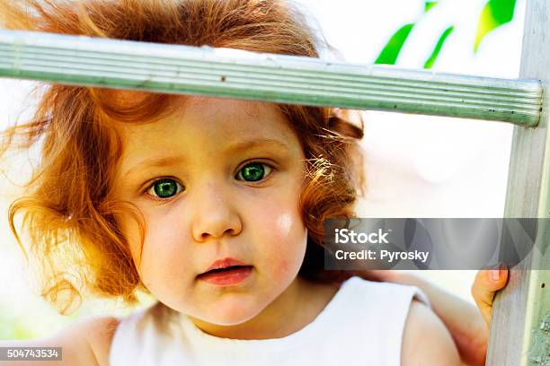 Little Redhead Girl Looking Straight To You Stock Photo - Download Image Now - 12-17 Months, 2-3 Years, Baby - Human Age