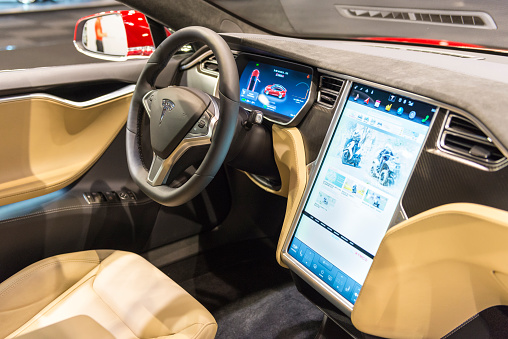 Brussels, Belgium - Januari 12, 2016: Luxurious interior on a Tesla Model S full electric luxury with a large touch screen and dashboard screen. The car is on display during the 2016 Brussels Motor Show. 