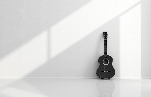 Black acoustic guitar in a  empty white room - 3D Rendering
