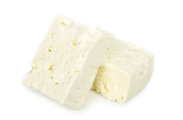 feta cheese blocks of feta cheese isolated on white feta cheese block stock pictures, royalty-free photos & images