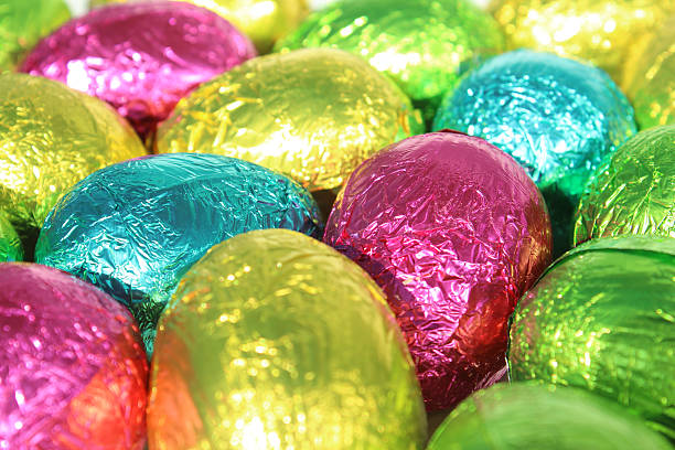 istock Image of shiny, multi-coloured, foil wrapped chocolate Easter eggs 504746076