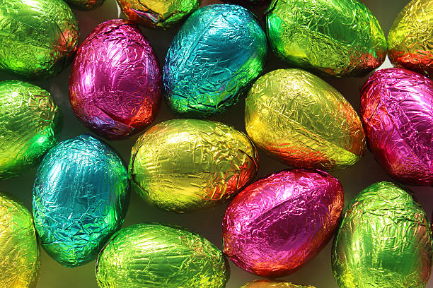 istock Image of yellow, blue, pink, green chocolate foil-covered Easter eggs 504746166