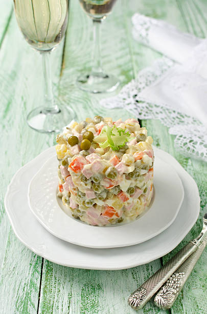 istock Russian traditional salad Olivier with vegetables and meat 504747252