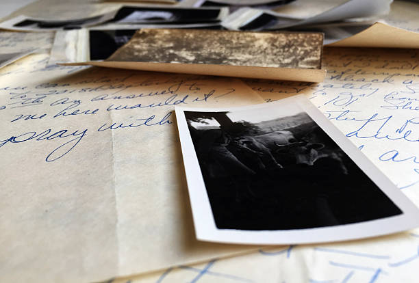istock Old Photographs on Old Handwritten Letters 504747882
