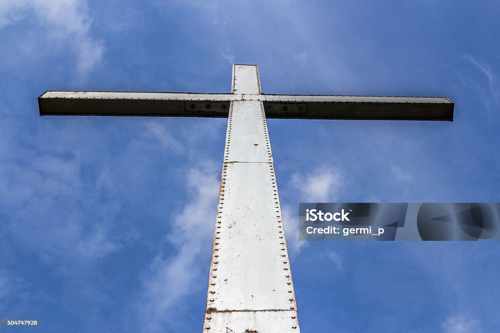 Big cross A large iron cross, immortalized in backlight. Awe Stock Photo