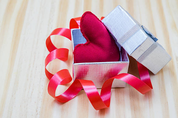 istock gift box with a bow and a red heart inside 504748510