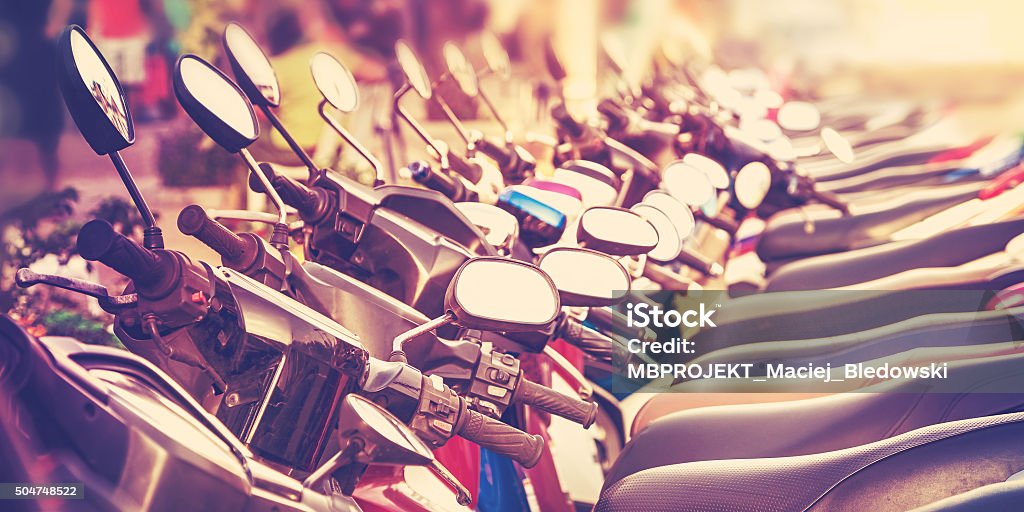 Vintage stylized picture of scooters in a row. In A Row Stock Photo