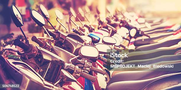 Vintage Stylized Picture Of Scooters In A Row Stock Photo - Download Image Now - In A Row, Motorcycle, Auto Post Production Filter