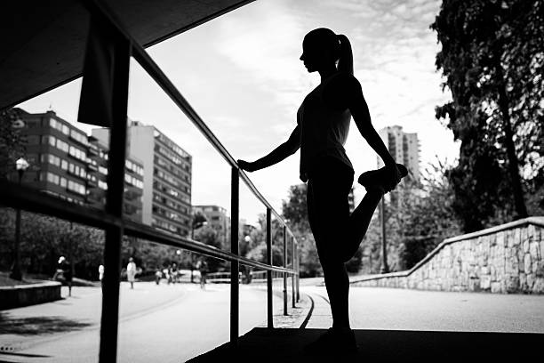 istock Woman Stretching silhouette 504748594