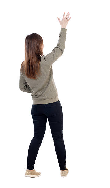 istock Back view of beautiful woman welcomes. 504748700