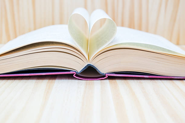 istock open book and forming a heart with their central leaves 504748974