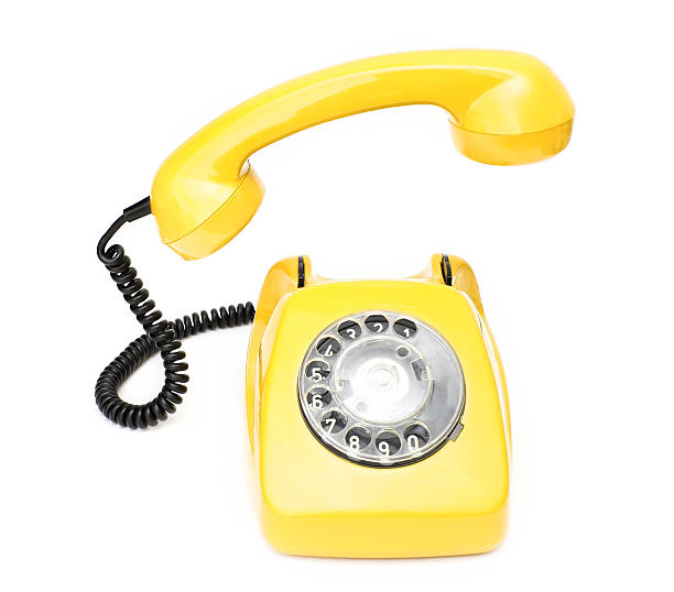 istock Yellow retro telephone isolated on white background. 504752264