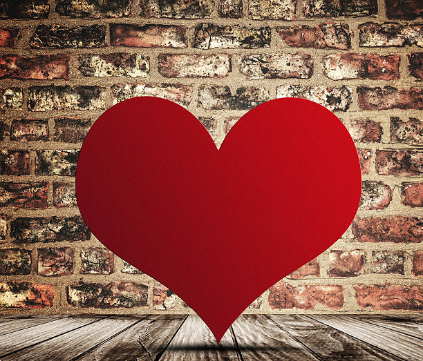 istock st. valentine heart shape on a brick wall 504753566