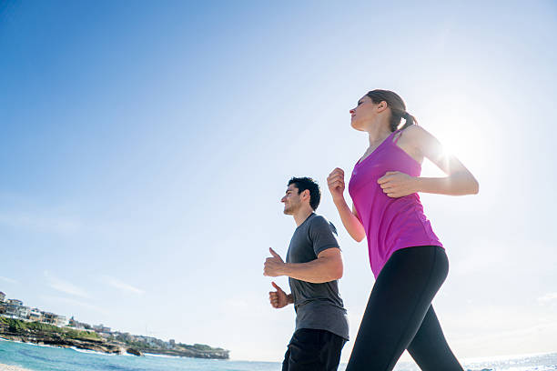 istock People running at the beach 504753802